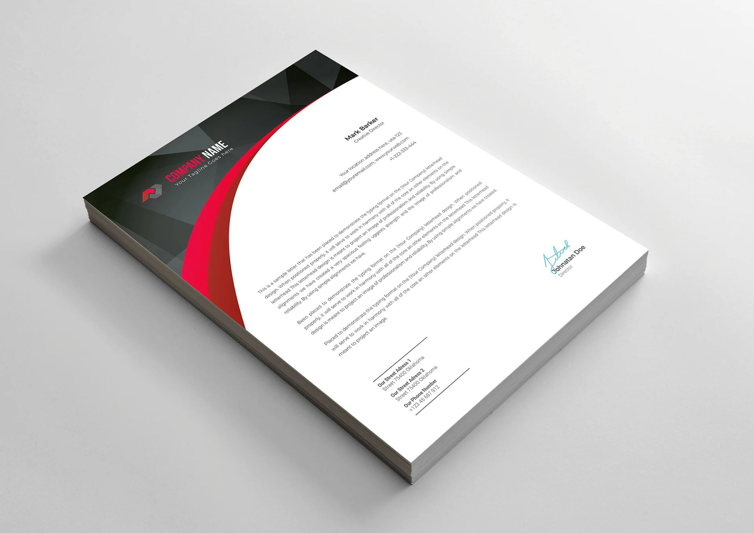 Hojas membretadas con diseño moderno en tonos rojo, negro y blanco, impresas por Gabella Artes Gráficas en Norte, Sevilla, ideales para correspondencia empresarial profesional.